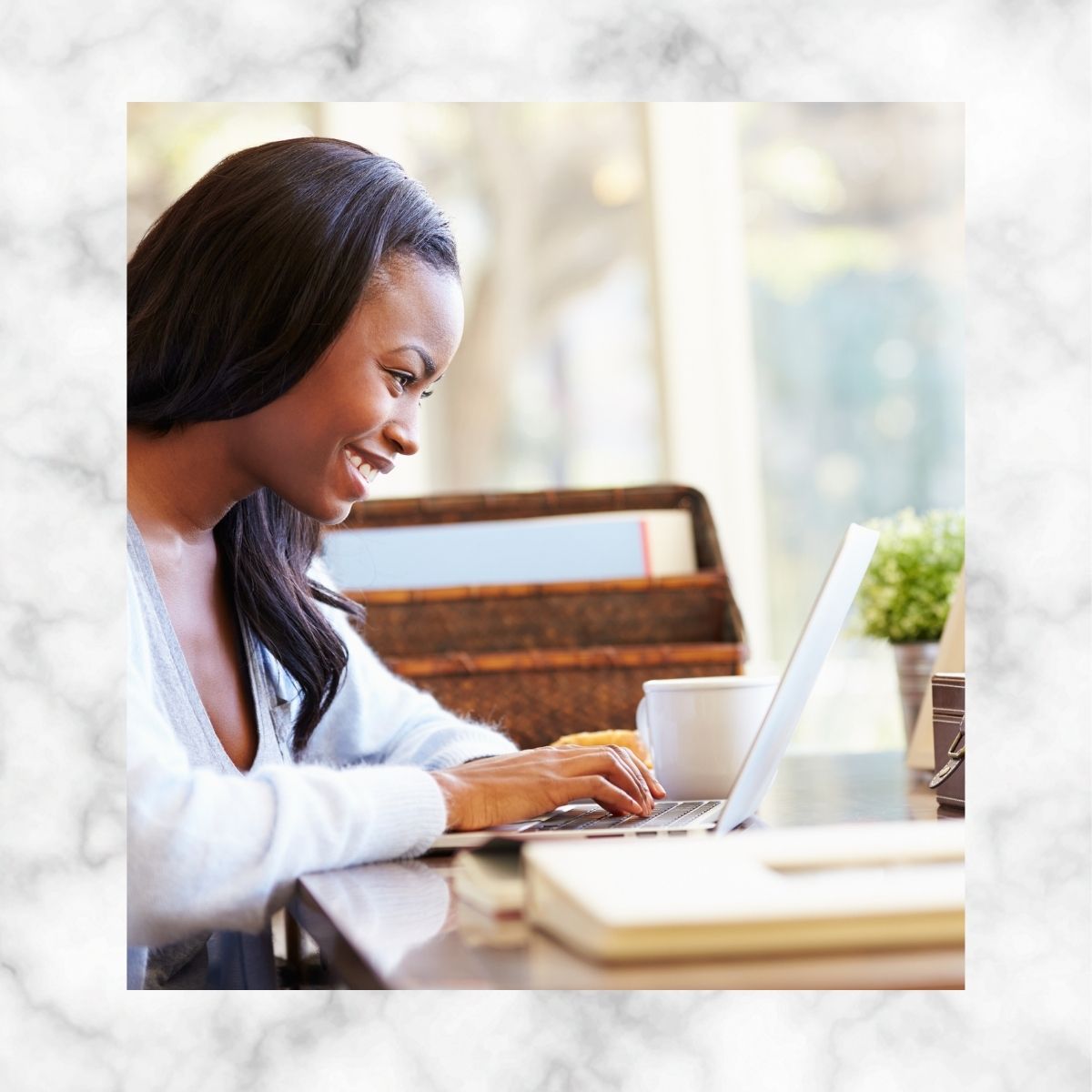 African American Women Working On Laptop at Home Image